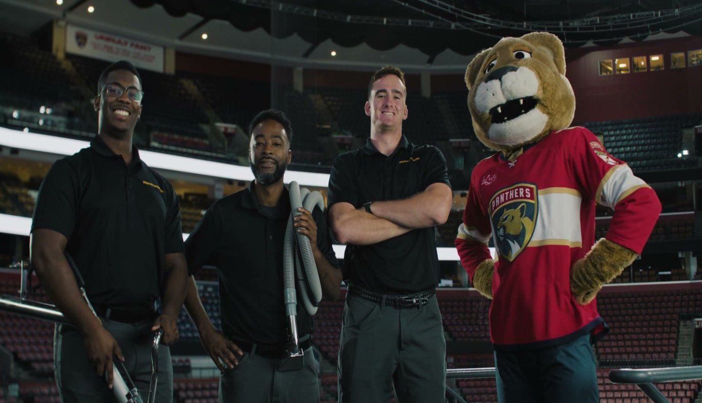 Stanley Steemer of South Florida technicians with the Florida Panthers mascot