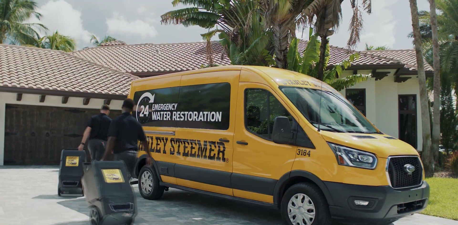 Stanley Steemer of South Florida van and crew at a customer's home